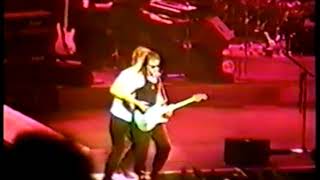 Michael Hutchence pushing Kirk Pengilly into the crowd (INXS)