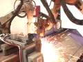 Motoman robots plasma cutting truck rails Motoman robots plasma cutting truck rails