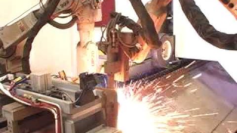 Motoman robots plasma cutting truck rails