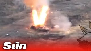 Russian tank is destroyed by Ukrainian bomb dropped through open hatch