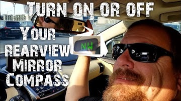 Turning on or off your rearview mirror compass
