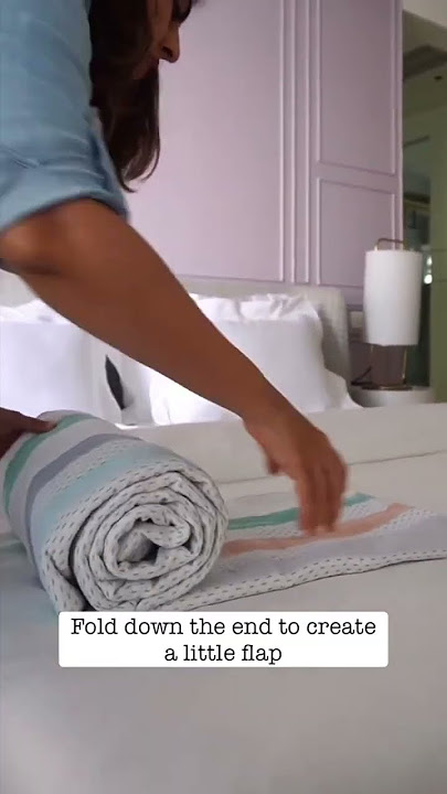 Turn your blanket into a bolster pillow by following these steps