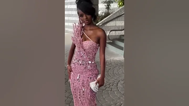 Share with a friend who would own the spotlight in this rose beaded mermaid gown! To order, send us