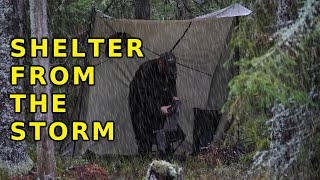Set up camp in rainstorm - Collects firewood - Eating food - Coffee on hobo stove in the night