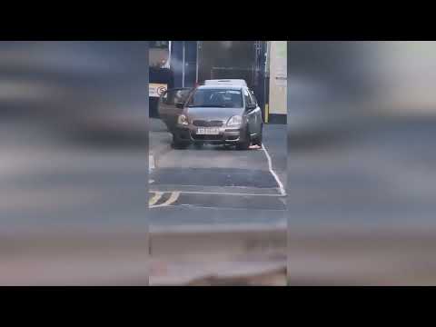 Oblivious bloke gets out of car to check parking - only for stranger to climb in and lock the doors