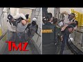 Jim jones brawls with two men on airport escalator claims selfdefense  tmz