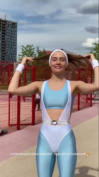 Beautiful Model Anna in shiny pink and blue lycra with rollerskates Part 1