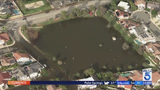 Torrential rains flood streets of Huntington Beach neighborhood