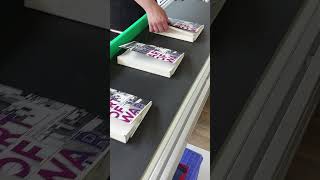 Book binding in action on JMD machinery from @invidiaprint7768
