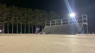 Skateboarder rides up quarter pipe at skatepark and lands on his rear then board hits sensitive area
