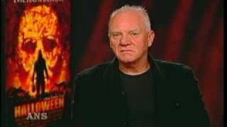 MALCOLM MCDOWELL LOOKS LIKE ROB ZOMBIE IN HALLOWEEN