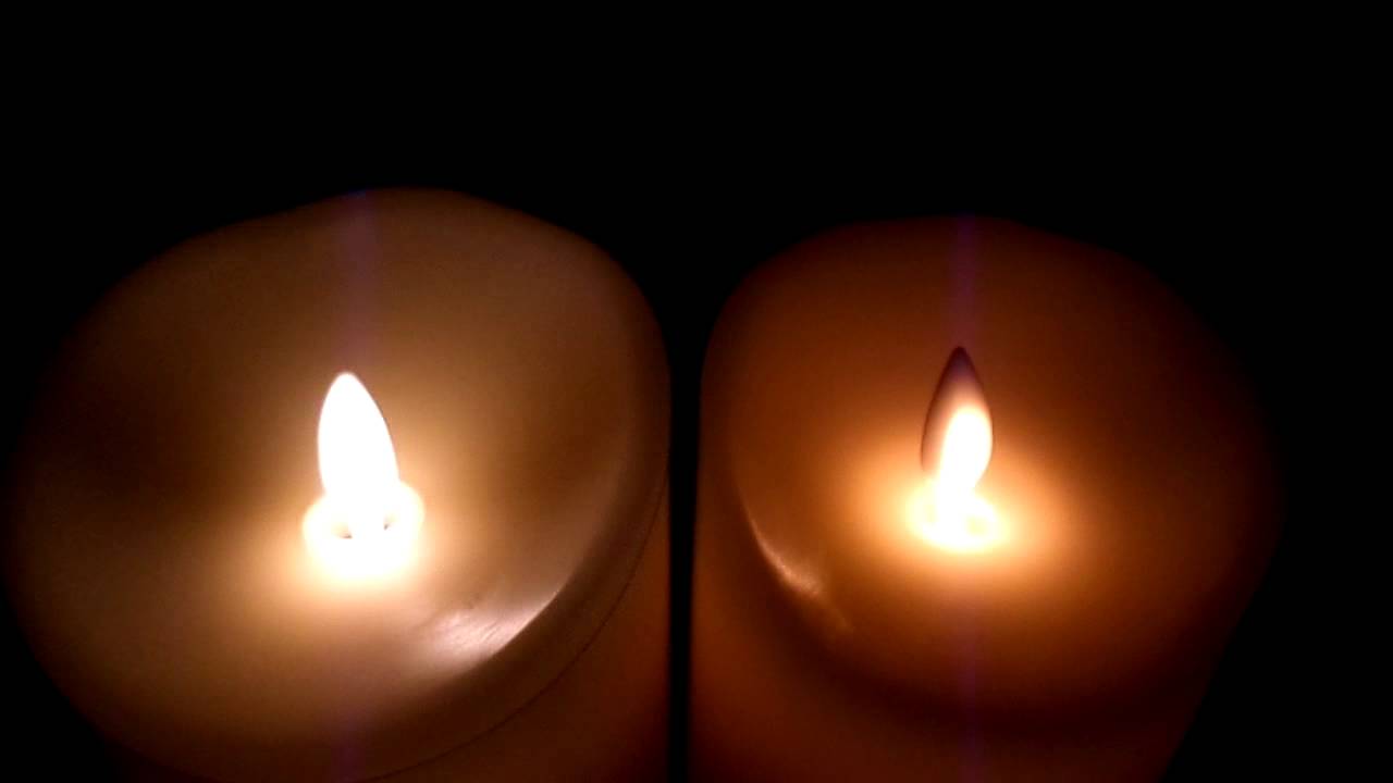 Luminara flameless candle on left vs. Mystique on right Luminara wins