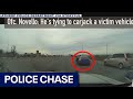 Suspect clings to car during police chase