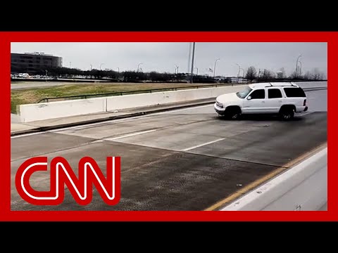 See cars slip and slide on icy bridge in Texas