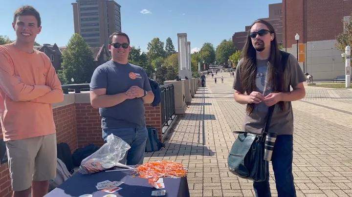 Students hand out free donuts to forge conversations