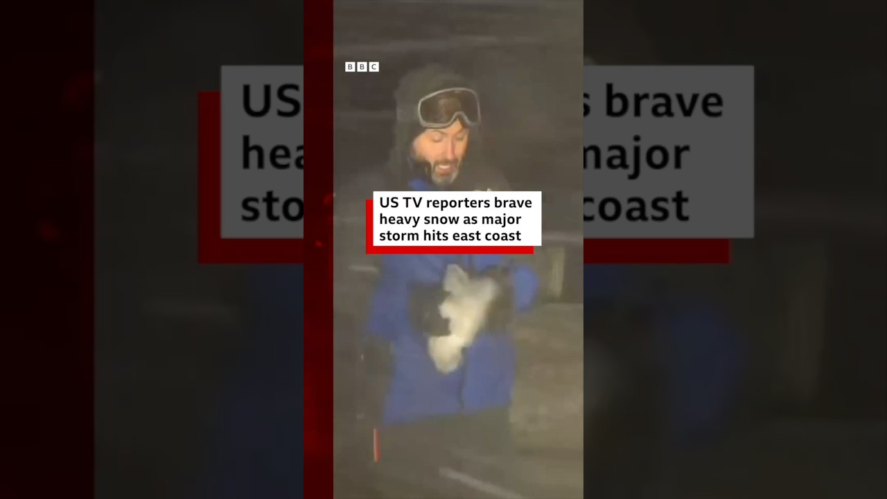 US TV reporters brave heavy snow as major storm hits east coast. 