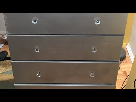 black dresser with silver hardware