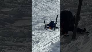 Skier Stuck Upside Down in Snow
