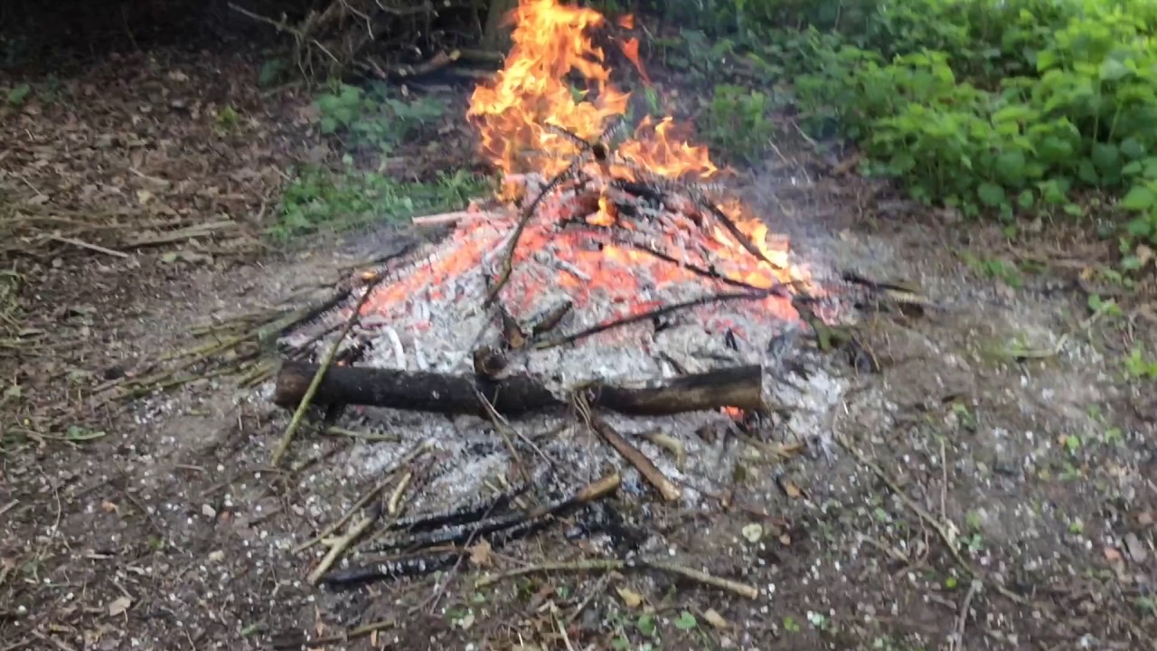 Baking Potatoes under a bonfire - YouTube