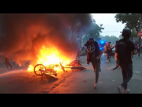 Paris Saint-Germain celebrations turn violent as fans clash with police in Paris