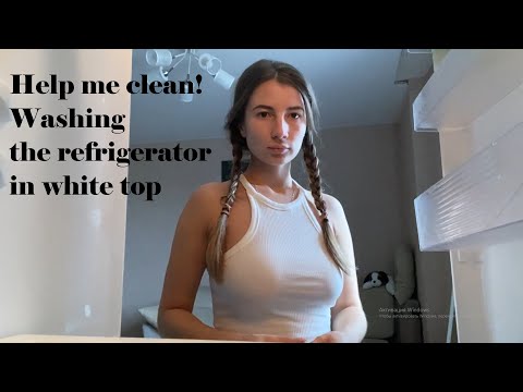 Washing the fridge in white crop top