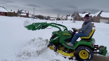 Little Bull Loader on a JD x485 Moving Snow in Texas