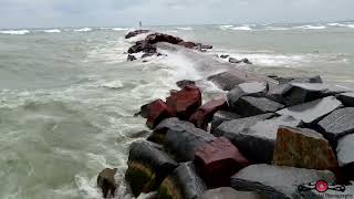 Flying low over the breakwall and getting the drone a little wet in the process 4K