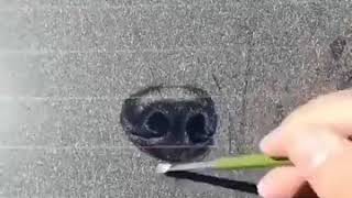 How to draw in the dust. Man uses a dusty car screen to draw a master piece