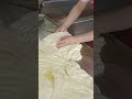 This is the process of pouring the batter into the frying pan, done carefully.#cake #shorts