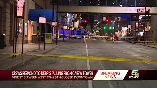 Crews respond after falling debris from Carew Tower causes street closures