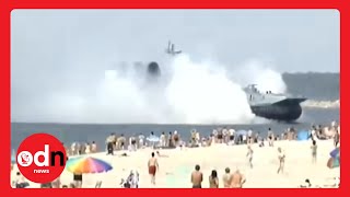 Amazing video of Russian military ship ploughing onto a crowded beach