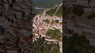 Stand in the village. Frame the valley from above.|Mavic 4 Pro
