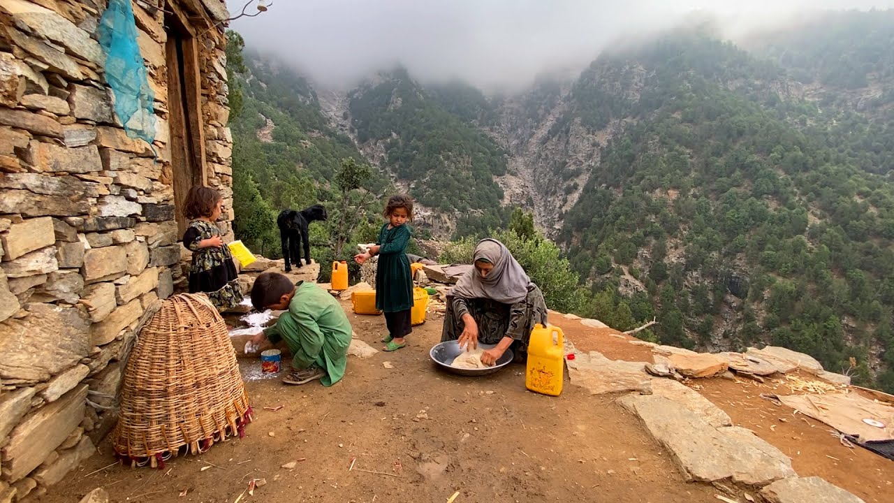 Hard Life of a Lonely Old Woman in High Mountains Village in Heavy Rainy Day Far From Civilization