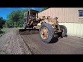 Caterpillar 212 Grader Removing Topsoil and Spreading Gravel