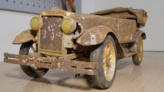 Restoration of an old toy car Phaeton