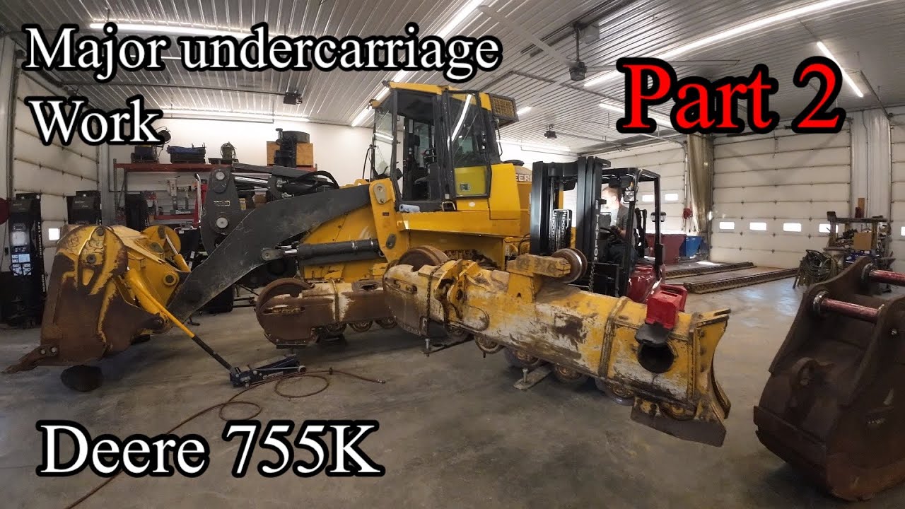 John Deere 755K crawler track loader major undercarriage repair work, removing track frames part