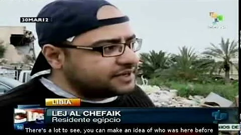 Visitors come to the ruins of Gaddafi's residence