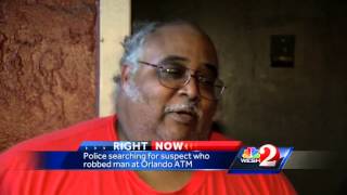 Police search for suspect who robbed man at ATM