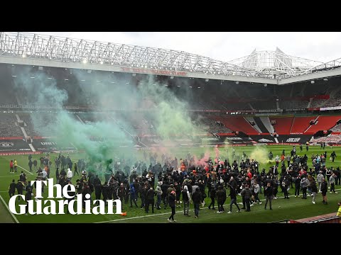 'Glazers out': Manchester United fans take to Old Trafford pitch during protest