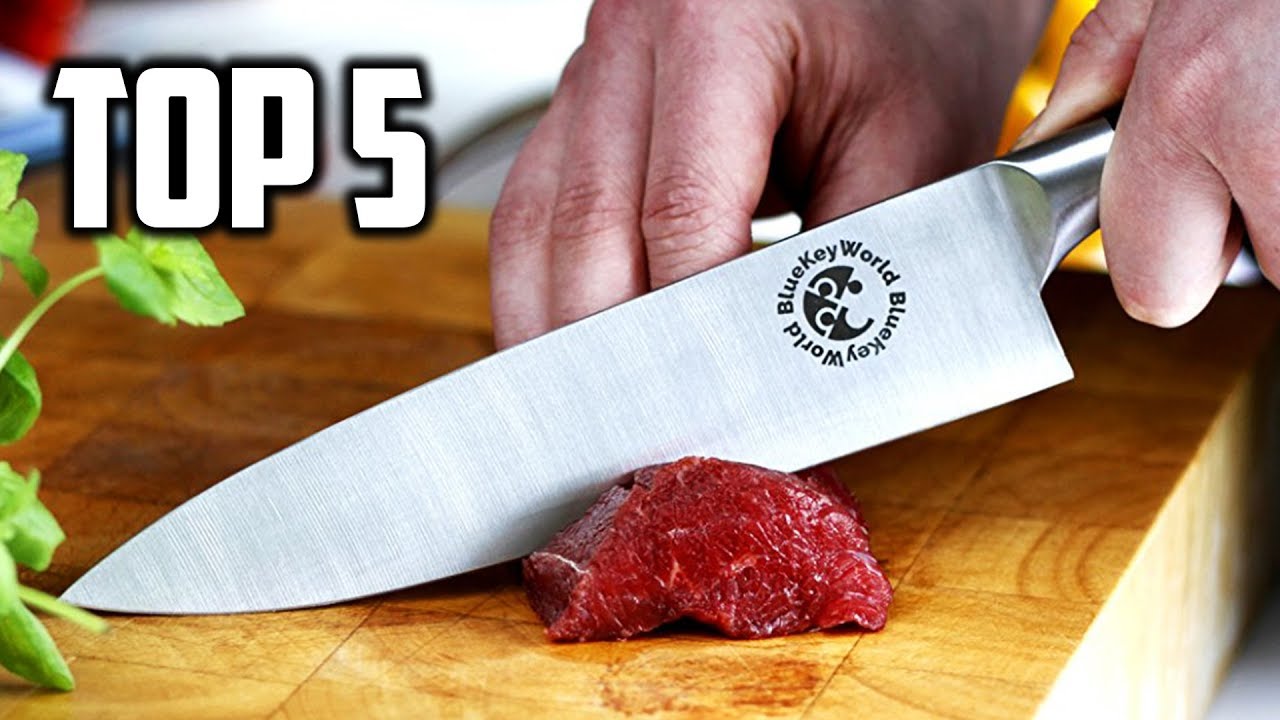 Meat cutting. Нож для нарезки мяса. Острый кухонный нож. Широкий кухонный нож.