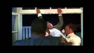 Big Red Davis Hangs Bird From A Balcony