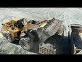 Caterpillar 990F Wheel Loader Loading Trucks