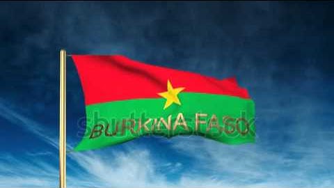 Burkina Faso flag slider style with title. Waving in the wind with cloud background animation Stock