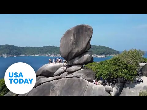 Tourists in Thailand wow over 'boat sail' shaped rock | USA TODAY