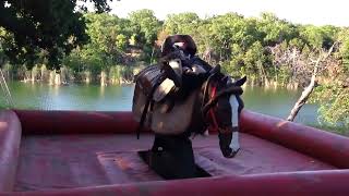 Trace Barrett (7), practicing some Bareback riding on our bucking machine at the house.