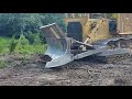 Clearing land with a d7 dozer and a clearing blade