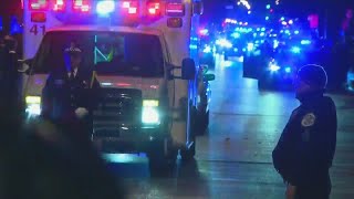 Officers escort ambulance carrying fallen Chicago police officer killed in Mercy Hospital shooting