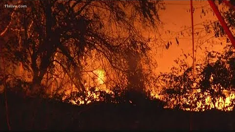 Firefighters work to contain large business fire