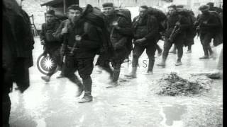 U.S. 137th Infantry troops march through a town in France during World War I. HD Stock Footage