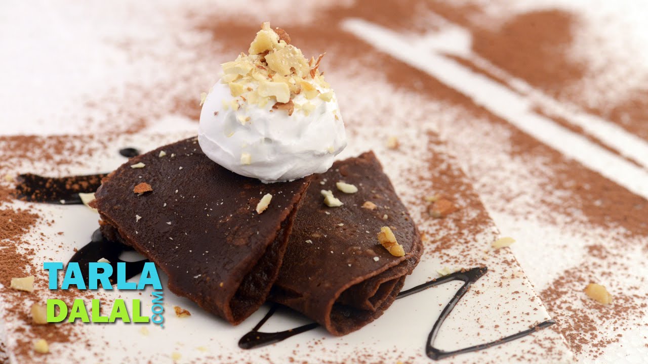 Chocolate Pancakes with Whipped Cream and Nuts by Tarla Dalal